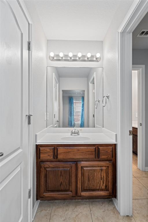 3912 Walsh Ranch Blvd, Round Rock, TX 78681 - bathroom with vanity and tile patterned flooring