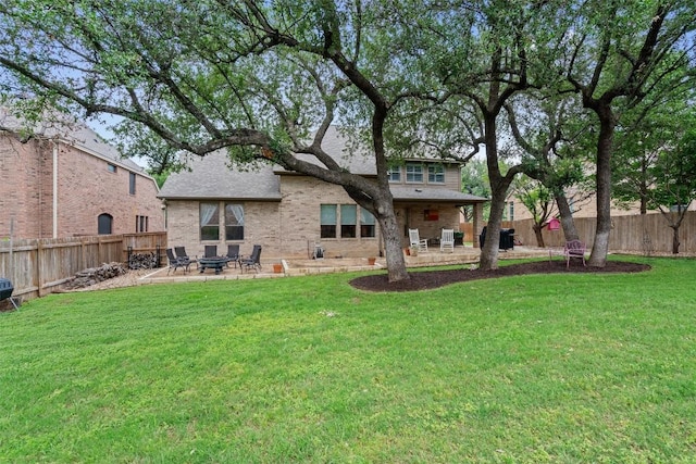 3912 Walsh Ranch Blvd, Round Rock, TX 78681 - back of house with a patio, brick siding, a fenced backyard, and roof with shingles