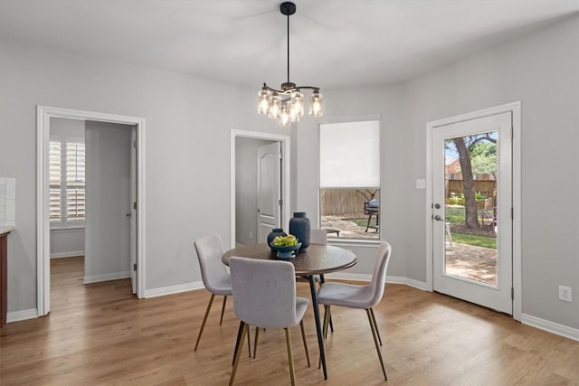 3912 Walsh Ranch Blvd, Round Rock, TX 78681 - dining room featuring a chandelier and light wood-style floors