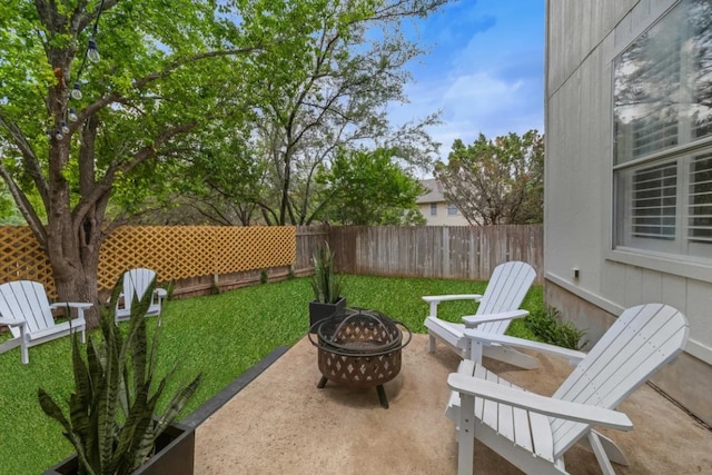12407 Old Salt Trl, Austin, TX 78732 - view of patio with a fenced backyard and an outdoor fire pit