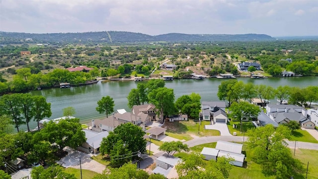 drone / aerial view with a residential view and a water and mountain view
