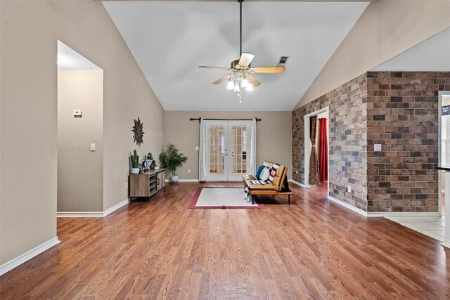 102 Vandeventer Dr, Burnet, TX 78611 - sitting room with vaulted ceiling, french doors, wood finished floors, a ceiling fan, and baseboards