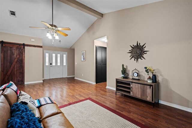 102 Vandeventer Dr, Burnet, TX 78611 - living room with a ceiling fan, wood finished floors, a barn door, and baseboards