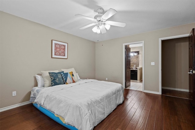 102 Vandeventer Dr, Burnet, TX 78611 - bedroom with wood finished floors, baseboards, connected bathroom, and ceiling fan