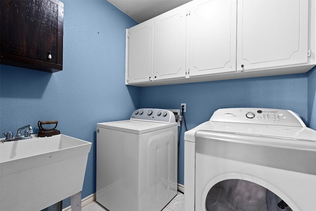 102 Vandeventer Dr, Burnet, TX 78611 - laundry area with washer and dryer, cabinet space, and baseboards
