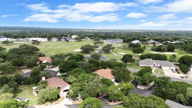 102 Vandeventer Dr, Burnet, TX 78611 - aerial view of residential area with a golf course and a tree filled landscape