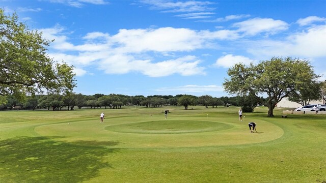 102 Vandeventer Dr, Burnet, TX 78611 - view of property's community with view of golf course and a lawn