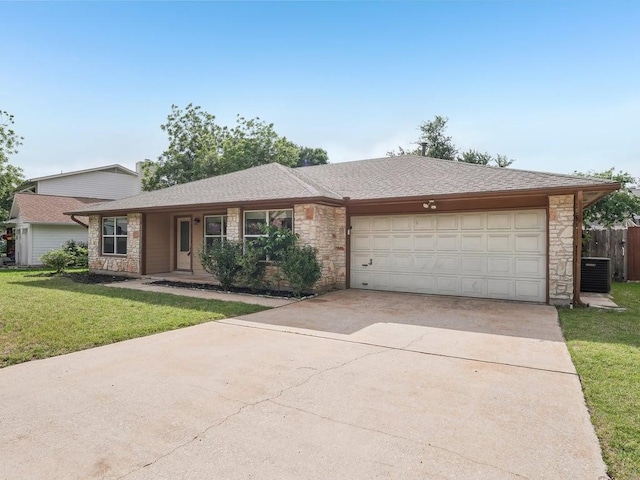 11911 Aloe Vera Trl, Austin, TX 78750 - ranch-style house with stone siding, central AC, a garage, and driveway