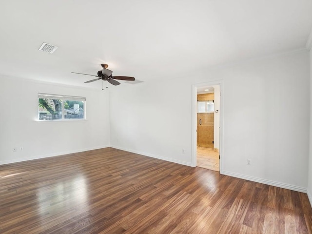 11911 Aloe Vera Trl, Austin, TX 78750 - spare room with a ceiling fan, wood finished floors, and ornamental molding