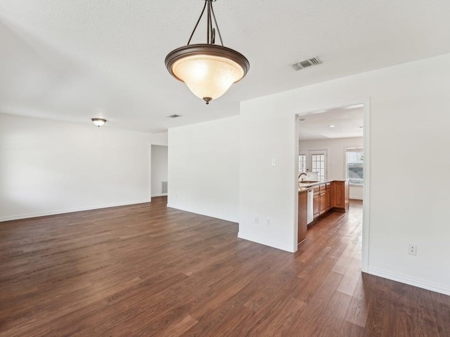 11911 Aloe Vera Trl, Austin, TX 78750 - spare room featuring dark wood-style flooring and baseboards