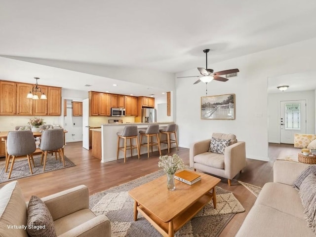 11911 Aloe Vera Trl, Austin, TX 78750 - living room with wood finished floors, ceiling fan, and recessed lighting