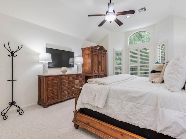 bedroom featuring visible vents, light carpet, baseboards, a ceiling fan, and vaulted ceiling