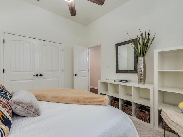bedroom featuring ceiling fan and a closet