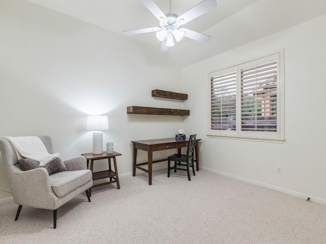 carpeted home office with a ceiling fan, baseboards, and vaulted ceiling