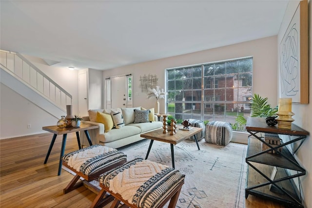 7253 Creekside Dr, Austin, TX 78752 - living area with a wealth of natural light, stairway, and wood finished floors