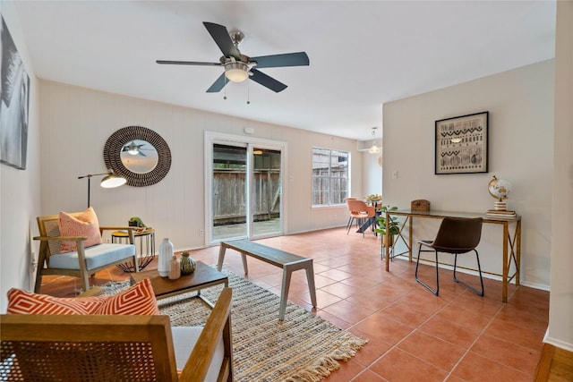 7253 Creekside Dr, Austin, TX 78752 - tiled living room featuring baseboards and a ceiling fan