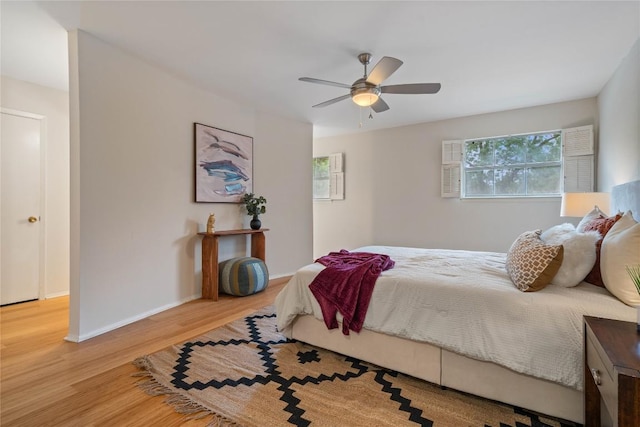 7253 Creekside Dr, Austin, TX 78752 - bedroom with baseboards, ceiling fan, and wood finished floors