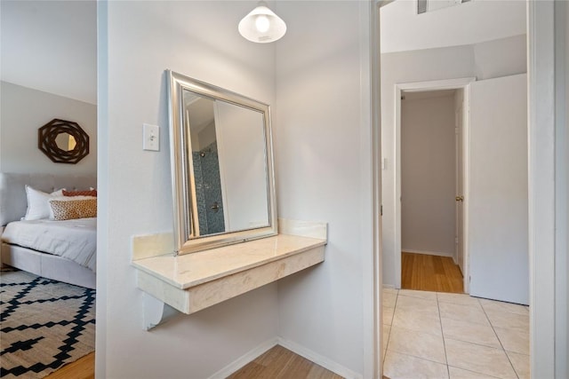 7253 Creekside Dr, Austin, TX 78752 - hallway featuring baseboards and light wood finished floors