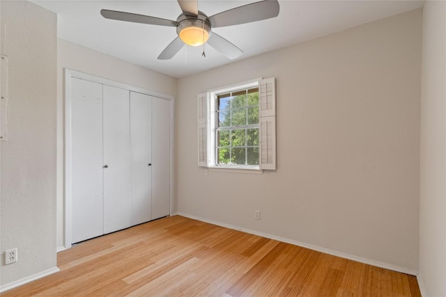 7253 Creekside Dr, Austin, TX 78752 - unfurnished bedroom featuring a ceiling fan, baseboards, light wood finished floors, and a closet