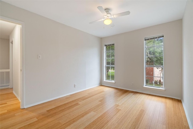 7253 Creekside Dr, Austin, TX 78752 - unfurnished room featuring a ceiling fan, baseboards, and light wood-style flooring
