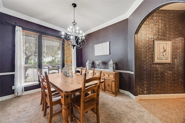 2607 Armatrading Dr, Cedar Park, TX 78613 - dining space featuring arched walkways, ornamental molding, a chandelier, baseboards, and light colored carpet