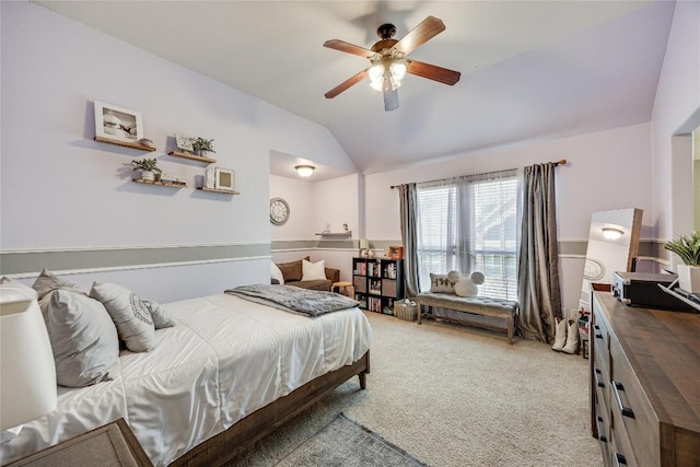 bedroom with carpet floors, a ceiling fan, and vaulted ceiling