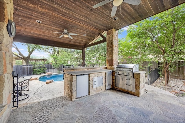 view of patio with exterior kitchen, a fenced backyard, a fenced in pool, a ceiling fan, and a grill