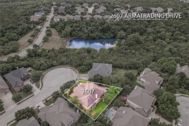 2607 Armatrading Dr, Cedar Park, TX 78613 - aerial view of residential area featuring property parcel outlined, a large body of water, and a forest