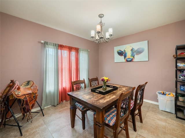 419 Spyglass St, Marble Falls, TX 78654 - dining area with a chandelier, baseboards, and light tile patterned flooring