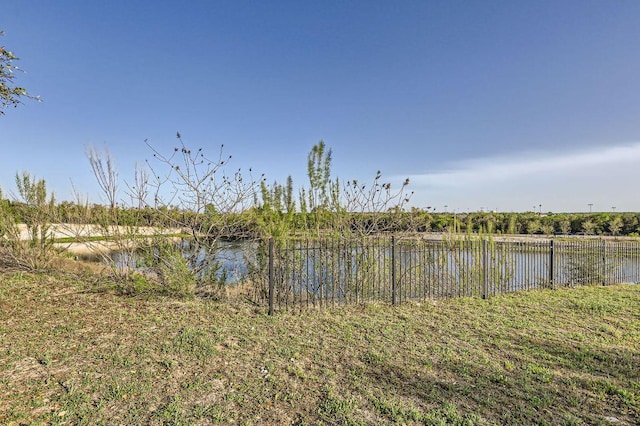 view of water feature with fence