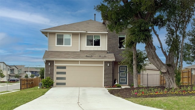 view of front facade featuring brick siding, fence, and driveway