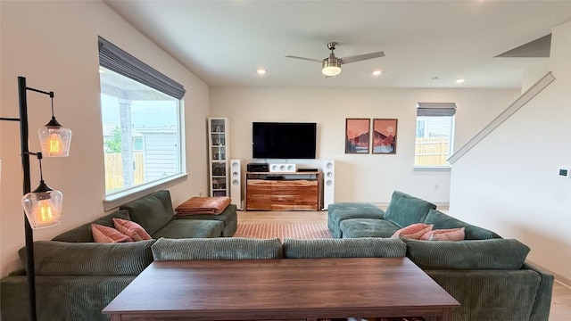 living room with recessed lighting, ceiling fan, and light wood-type flooring