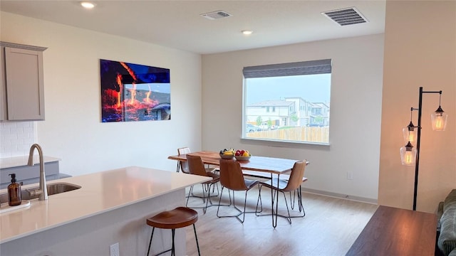 dining space featuring visible vents, recessed lighting, and light wood finished floors