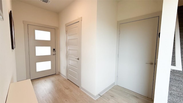 foyer featuring visible vents and light wood finished floors
