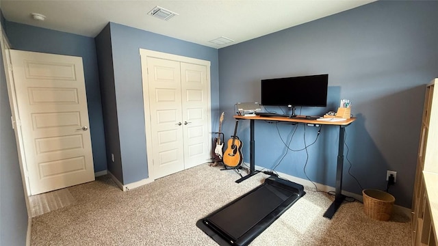 workout area featuring carpet floors, baseboards, and visible vents