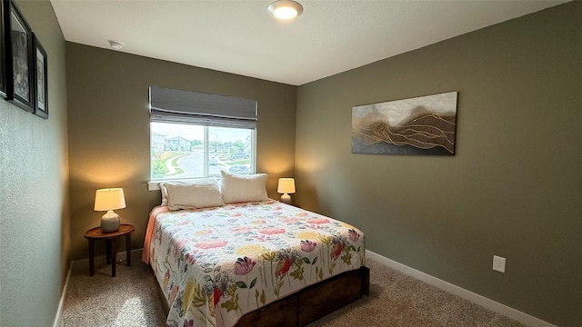 bedroom featuring carpet floors and baseboards