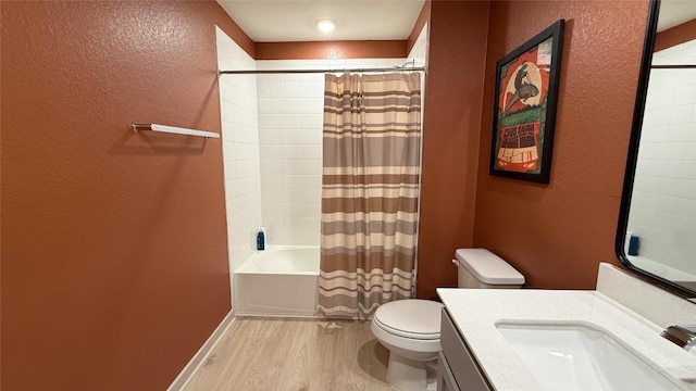 full bathroom featuring a textured wall, wood finished floors, shower / bath combo, and toilet