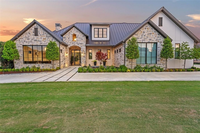 1016 Ferguson Mill Rd, Salado, TX 76571 - view of front of home featuring a yard, a standing seam roof, metal roof, and stone siding