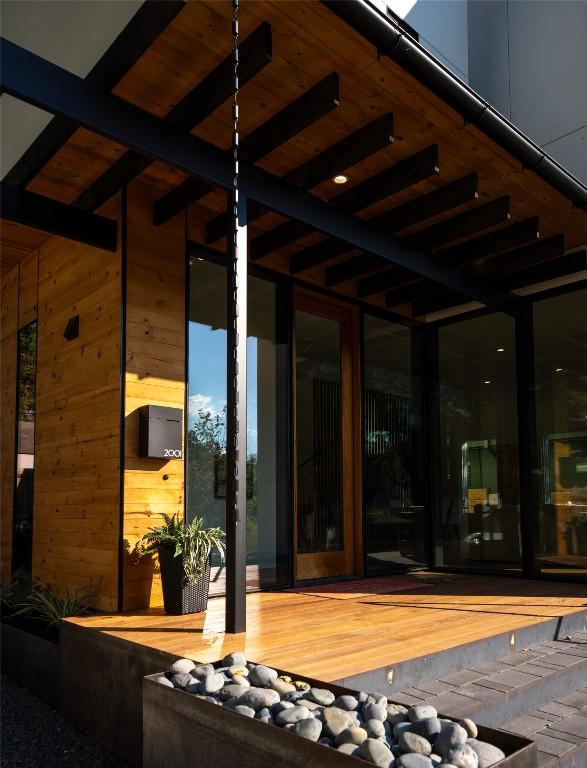 entrance to property featuring a wooden deck