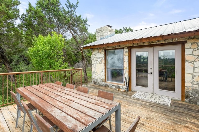 8100 Kuhn Dr, Austin, TX 78736 - wooden terrace with french doors and outdoor dining space