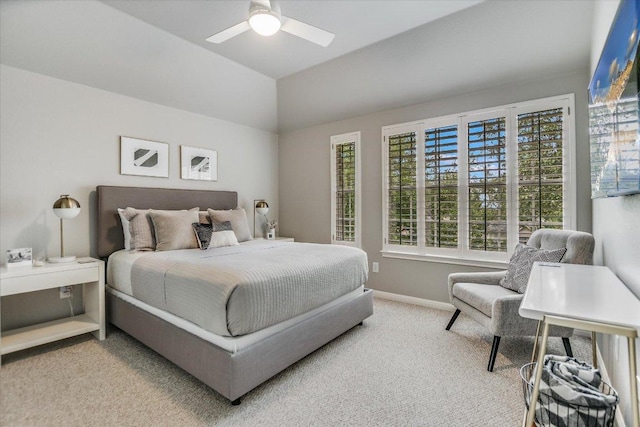 bedroom with vaulted ceiling, baseboards, ceiling fan, and carpet flooring