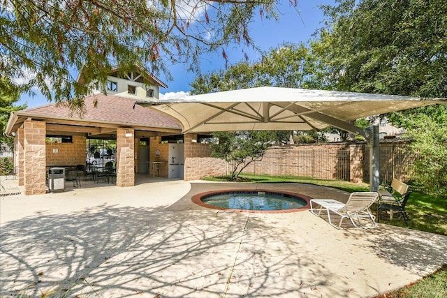 view of swimming pool featuring a patio, an in ground hot tub, and fence