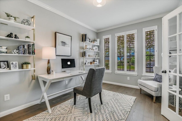 office space featuring baseboards, ornamental molding, and wood finished floors