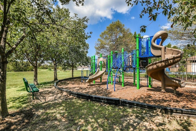 community playground featuring a lawn