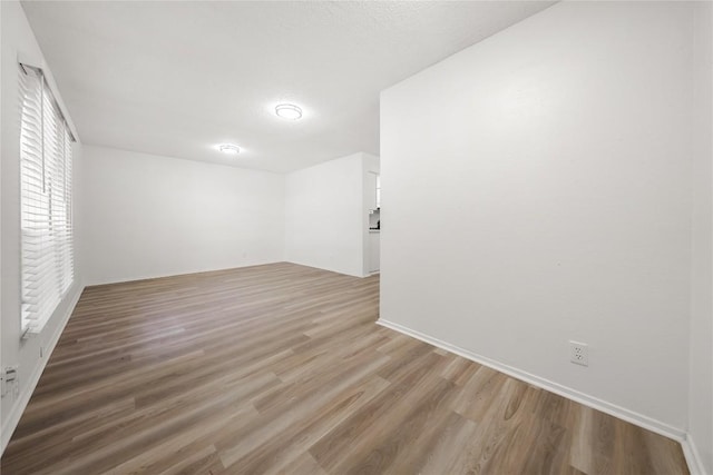 101 E 33rd St Unit 104, Austin, TX 78705 - unfurnished room with baseboards and wood finished floors