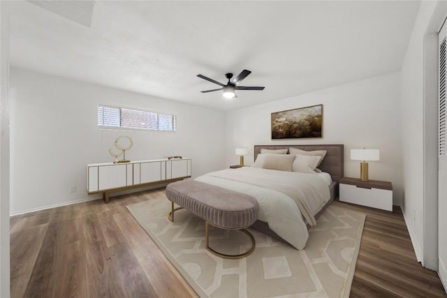 101 E 33rd St Unit 104, Austin, TX 78705 - bedroom with baseboards, a ceiling fan, and wood finished floors