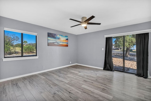 721 Fawn, Horseshoe Bay, TX 78657 - spare room featuring plenty of natural light, wood finished floors, and a ceiling fan
