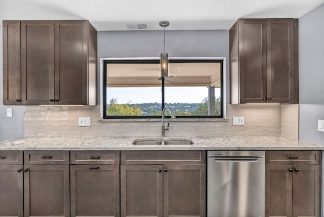 721 Fawn, Horseshoe Bay, TX 78657 - kitchen with dishwasher, backsplash, dark brown cabinets, and light stone countertops