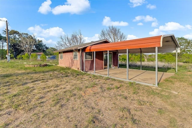 950 County Road 221, Tow, TX 78672 - back of property featuring a yard, a patio area, and a carport