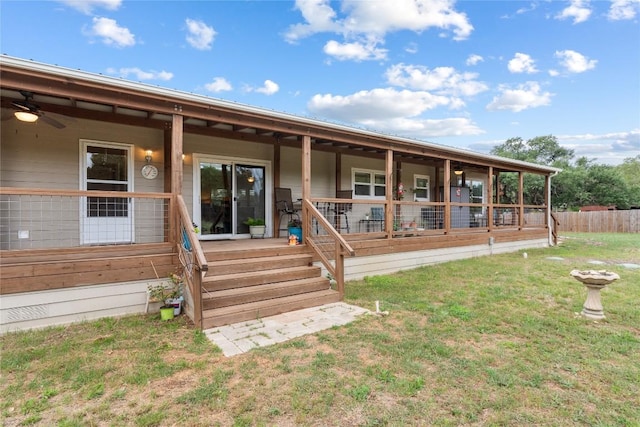 exterior space featuring fence and a front yard